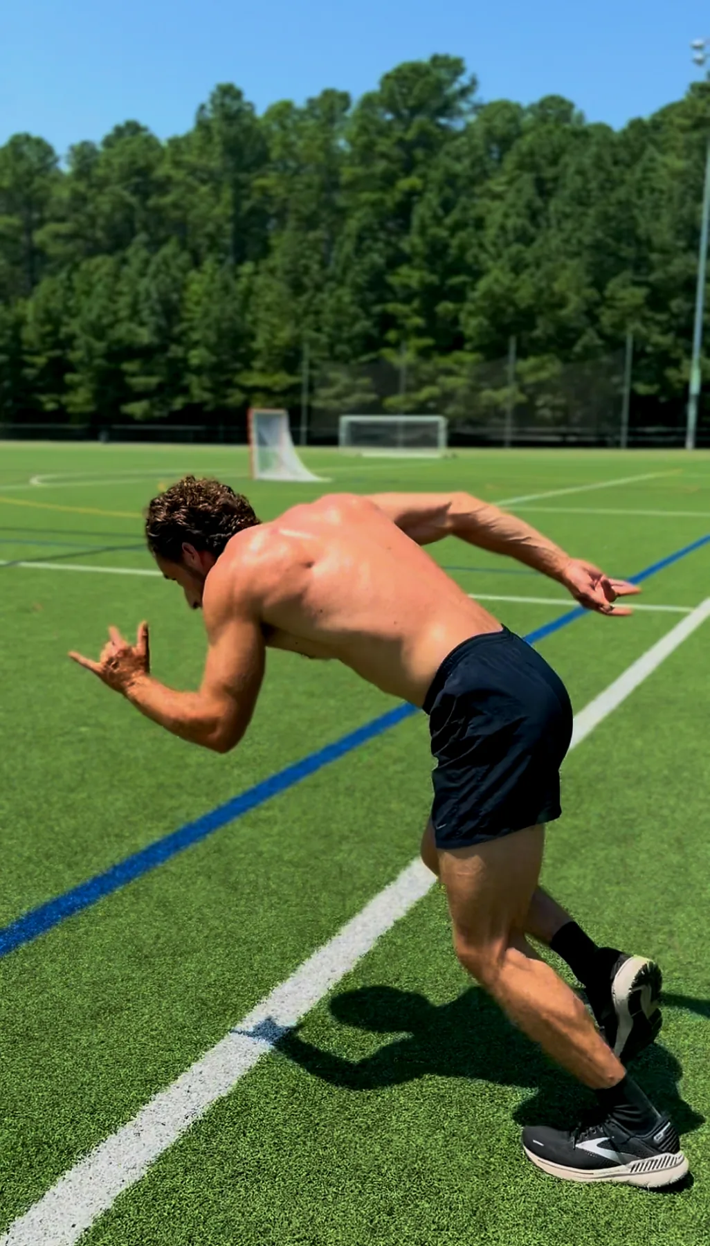 Michael sprinting on an open field