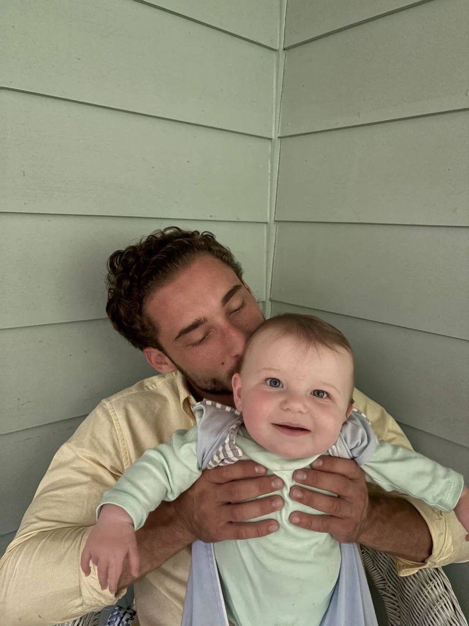 Michael at home with one of his daughters